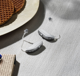 hearing aid beside computer